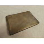 A rectangular sliding opening cigarette case with engine turned decoration,