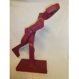 An unusual papier mache and wood sculpture of a running male form by local artist/sculptor Peter