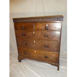 An early 19th Century mahogany chest of two short and three long drawers with turned handles on