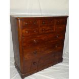 A 19th Century mahogany chest of drawers with central hat drawer flanked by four small drawers
