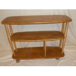 A 1960's/70's Ercol light elm three tier mobile trolley