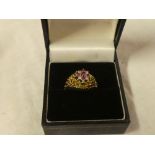 An 18ct gold dress ring set rubies and diamonds