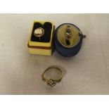 An 18ct gold dress ring set blue stones (damaged);