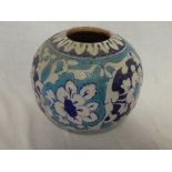 An Indo-Persian pottery circular vase with turquoise and blue floral decoration,
