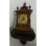A German bracket clock with brass and silvered square dial in polished walnut rectangular case with