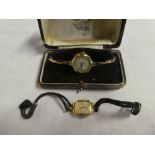 A ladies 14ct gold wristwatch by Oebra with leather strap and a ladies 9ct gold wristwatch with