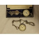 A ladies silver cased fob watch with circular enamelled dial together with silver chain and fob and