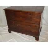 A George III mahogany chest of four long graduated drawers with brass ring handles on bracket feet