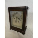 A German mantel clock with silvered rectangular dial in polished mahogany rectangular case
