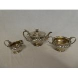 An impressive George IV Scottish silver circular three piece tea set comprising circular tea pot
