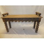 A 19th Century carved oak rectangular hall seat/window seat on bobbin turned supports,