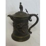 A 19th Century bronze and silver plated ornamental lidded jug decorated in relief with numerous