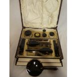 A good quality silver and tortoiseshell mounted dressing set comprising hand mirror,