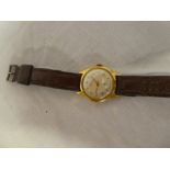 A gentleman's gold mounted wristwatch by Oris with leather strap (af)