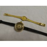 A ladies 15ct gold wristwatch with decorated circular dial and leather strap and one other quality