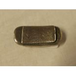 A George V silver shaped-rectangular snuff box with hinged lid and engraved decoration,