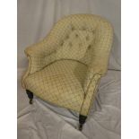 A Victorian tub-style easy chair upholstered in button fabric on turned legs and brass casters