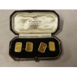 A pair of 9ct gold rectangular cufflinks with engraved decoration,