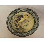 A Cornish studio pottery circular charger with fish decoration by A Brough,