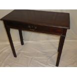 A late Victorian mahogany rectangular side table with a single drawer in the frieze on square