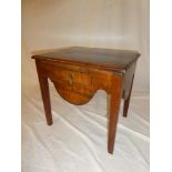 A Georgian mahogany night stand with a single drawer in the frieze on square shaped legs