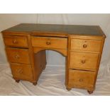 A 19th Century polished pine pedestal desk with in-set leather writing surface,