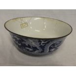 A 19th Century Chinese circular bowl with blue and white dragon decoration, 8½" diameter,