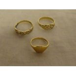 A small 9ct gold signet ring and two various 9ct gold dress rings with pierced mounts (3)