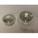A George V silver circular ring box with hinged lid on three paw feet,