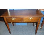 A 19th Century oak rectangular side table with a single drawer in the frieze on turned legs