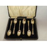 Set of six George V silver coffee spoons with decorated handles,