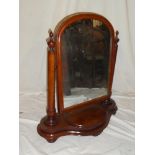 A mid-Victorian mahogany arched toilet mirror on turned columns,