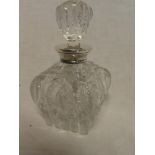 A good quality cut glass square tapered scent bottle and stopper with silver mounted rim,
