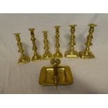 Three pairs of 19th Century brass ejector candlesticks and a brass chamber candlestick on