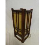 A Chinese mahogany square section floor lamp with fabric lined panels