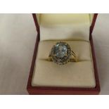 A 9ct gold dress ring set aquamarine & diamond chips