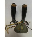 A pair of leather riding boots with wooden trees,