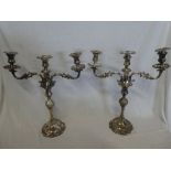 A pair of good quality silver plated three branch candelabra with detachable branches on tapered