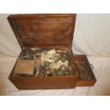 An old rectangular fitted wooden trunk containing a selection of various chemistry glass,