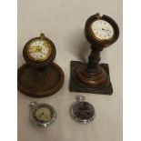 Four various gent's pocket watches and two wooden pocket watch stands (af)