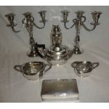 A pair of good quality electroplated three-branch candelabra on tapered stems;