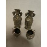 A pair of Indian silvered circular salts with raised decoration and a pair of small Indian white
