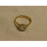 An 18ct gold and platinum mounted engagement ring set a diamond solitaire of approximately 1 carat