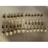 A set of twelve matching Victorian silver fiddle pattern serving spoons,