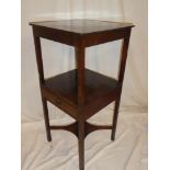 A George III mahogany square two-tier night stand with a single drawer in the frieze on