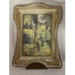 A George V silver rectangular photo frame with raised floral decoration, 8" high,