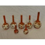 Four Japanese Kutani china spill vases with painted floral decoration and three other similar spill