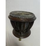 A late Victorian mahogany plant stand with ribbed decoration and zinc liner on brass claw and ball