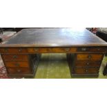 A large Victorian mahogany rectangular partners desk with in-set writing surface,