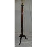 A good quality carved mahogany standard lamp with fluted column and tripod base